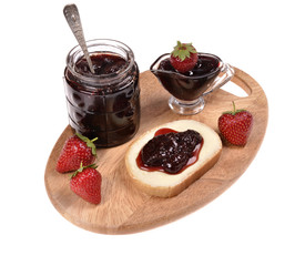 strawberry jam on toast ,jar of jam isolated on white 