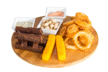 Cheese sticks, onion rings, crackers, salted peanuts and sauce
