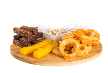 Cheese sticks, onion rings, crackers, salted peanuts and sauce
