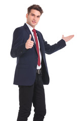 young business man showing the thumbs up gesture
