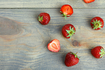 Fresh strawberries on a wooden background