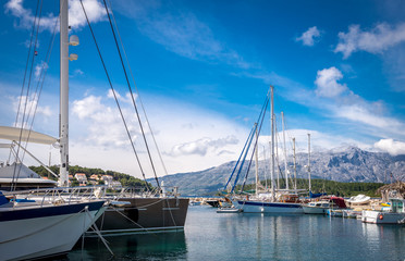 Fototapeta premium Luxury yachts and sailing boats in marina
