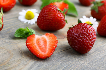 Fresh strawberries on a wooden background
