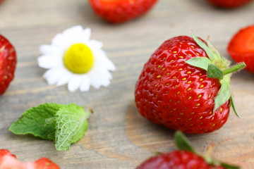 Fresh strawberries on a wooden background