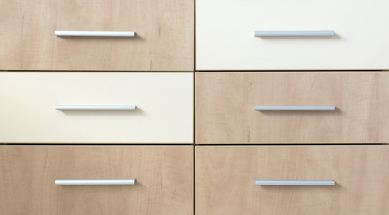 Cropped cabinet with six symmetric drawers. Abstract image of side furniture cabinet business desk...