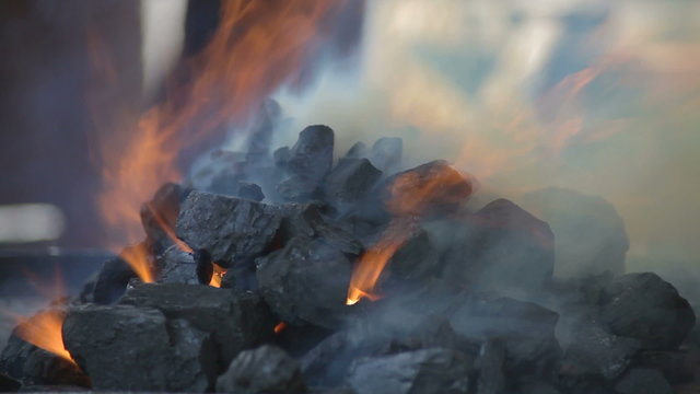 Hot burning embers in brazier, closeup