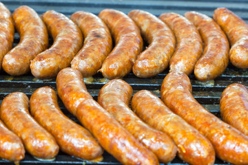 Delicious homemade sausages on the barbecue grill