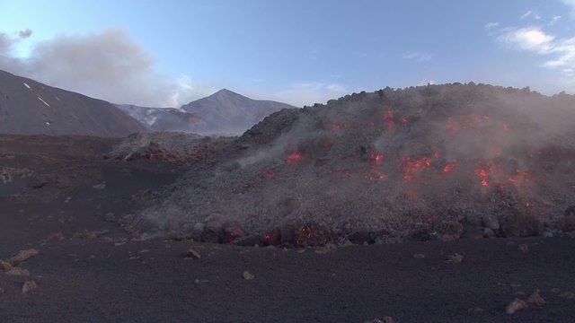 Volcano lava flow. Etna eruption in May 2015