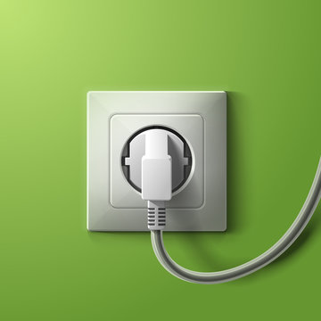 Realistic electric white socket and plug on green wall backgroun