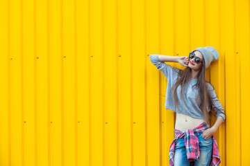 Beautiful Bool Girl over Yellow Wall