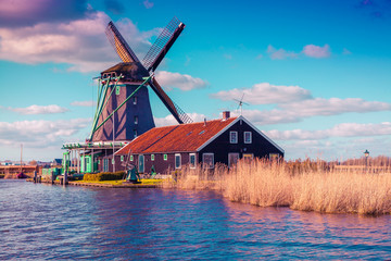 Authentic Zaandam mills on the water channel in Zaanstad village