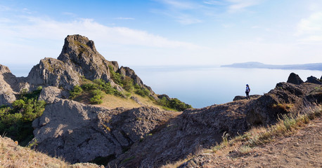 Tourist with  standing on a mountain.