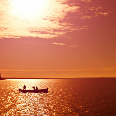 Fototapeta premium Fishing boat at Sunset in the Ocean