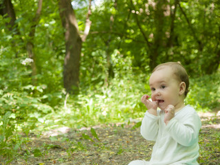 Happy baby crawling in the Park.