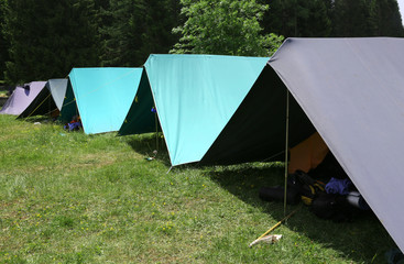 row of tents in the summer camp of the boyscout