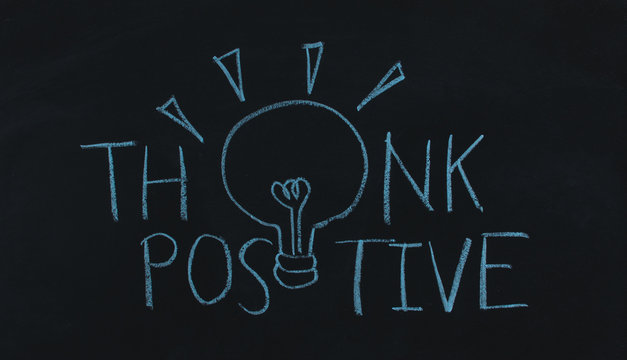 drawing word think positive and light bulb