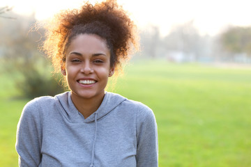 Smiling young african american woman outdoors