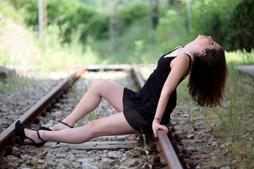 Beautiful young woman and vintage train