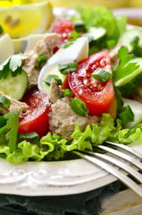 Vegetable salad with eggs and cod liver.