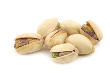 Fototapeta premium Pistachio nuts on a white background