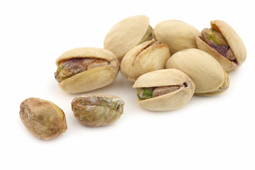 Pistachio nuts on a white background