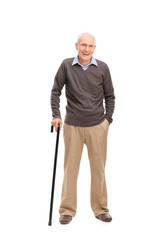 Senior man with a cane smiling and posing