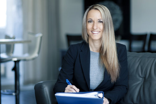 Blond Confident Businesswoman Working At Home