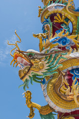 Fototapeta na wymiar Dragon statue on pole with cloud like fuming dragon. 