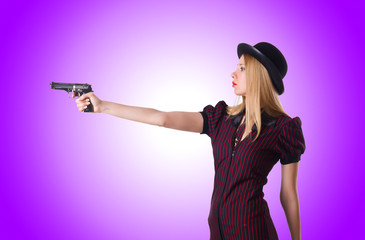 Woman gangster with handgun on white