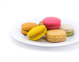 Colorful macarons on white background