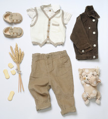 top view fashion trendy look of baby boy clothes with toy and co