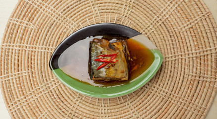 Saba fish in teriyaki sauce on rattan background 