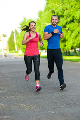 Runners training outdoors working out. City running couple