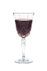 Red wine in crystal glass isolated in white