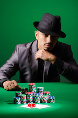 Man playing in dark casino