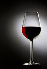 Glass of red wine on dark background