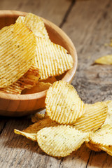 Rippled potato chips in a  bowl, selective focus