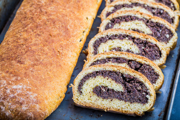 Homemade poppy seed cake on a tinware