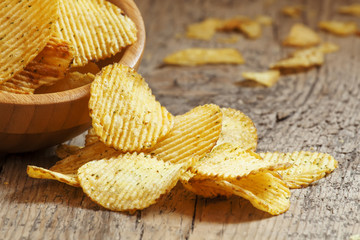Rippled potato chips in a  bowl, selective focus