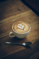 coffee latte art on the wood desk