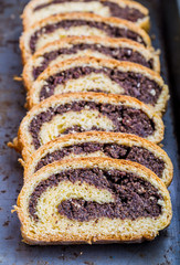 Homemade poppy seed cake on a tinware