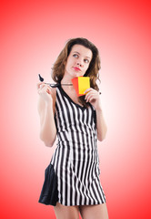Woman referee with card on white