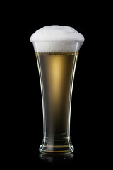 Beer. Beer into glass on black background