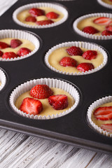 raw strawberry muffins in baking dish macro