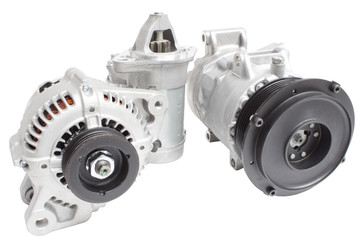 photos on the composition of the three parts for the engine. Generator, air conditioning compressor and the starter on a white background © stason4ik