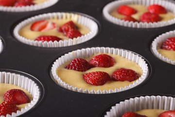 aw strawberry muffins in baking dish macro. horizontal
