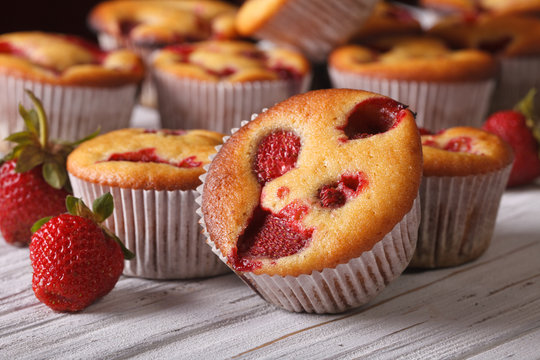 muffins with fresh strawberries close-up horizontal
