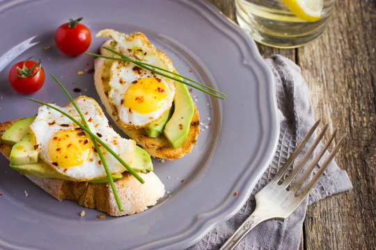 toast with fried quail eggs and avocado