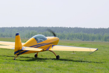 Fototapeta na wymiar The image of a sport propeller airplane