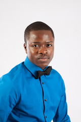 thoughtful black man in blue shirt